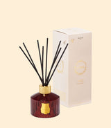 Diffuseur de parfum Trudon Cire en verre rouge avec bâtons en rotin pour la maison
