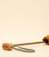 Umbrella Anatole Auguste Orange. Titanium and aluminum handle. Wooden head. White and black cord.