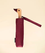 cherry umbrella by Original Duckhead. Duck head wooden handle. Closed with pocket.