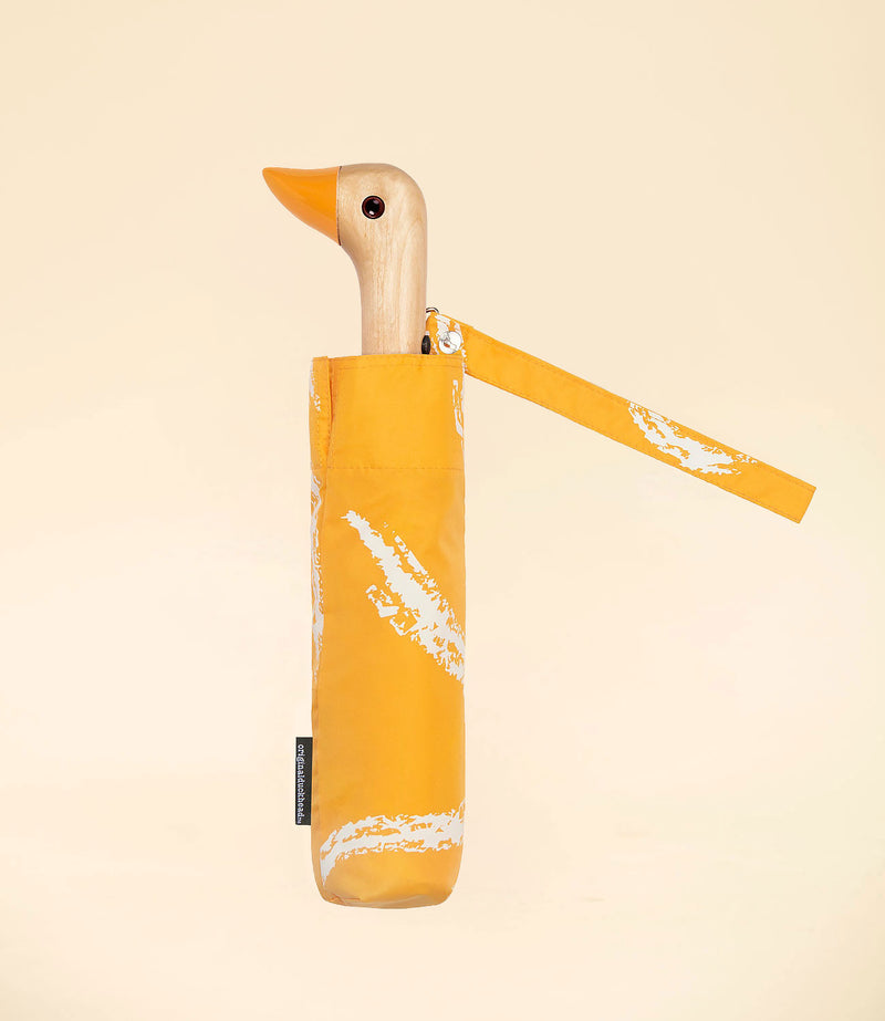 parapluie Saffron Brush par Original Duckhead. Manche en bois tête de canard. Fermé avec pochette.
