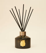 Gabriel diffuser by Trudon. Smoked fluted glass with 8 natural rattan sticks.